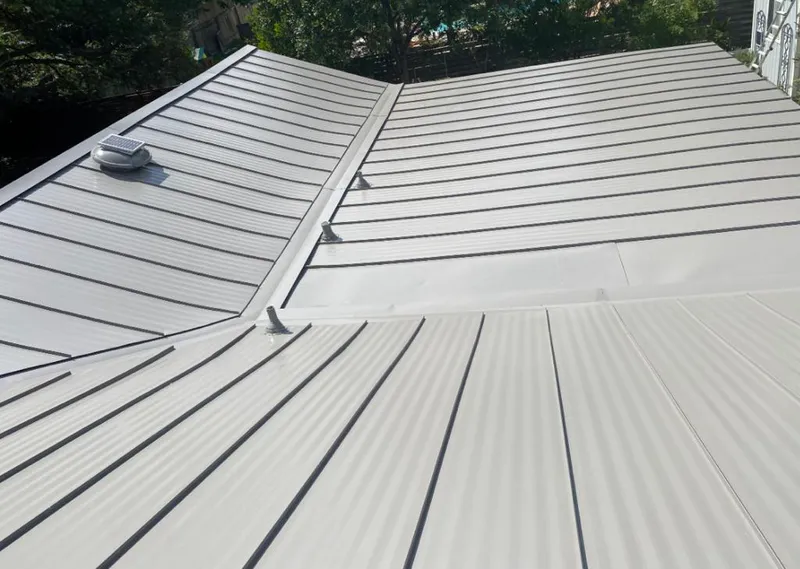 Solar attic fan installed on a metal roof for Roof Ventilation in Mahwah